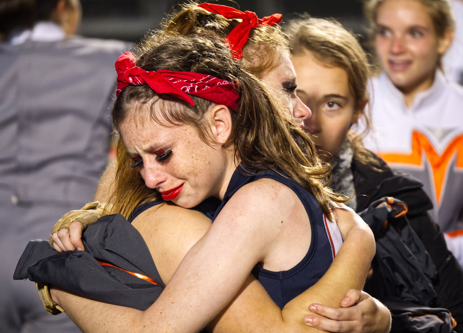 Colorguard members Jenna Haggerton and Adrian French embrace, overjoyed after winning the area marching contest Saturday in Carthage.
